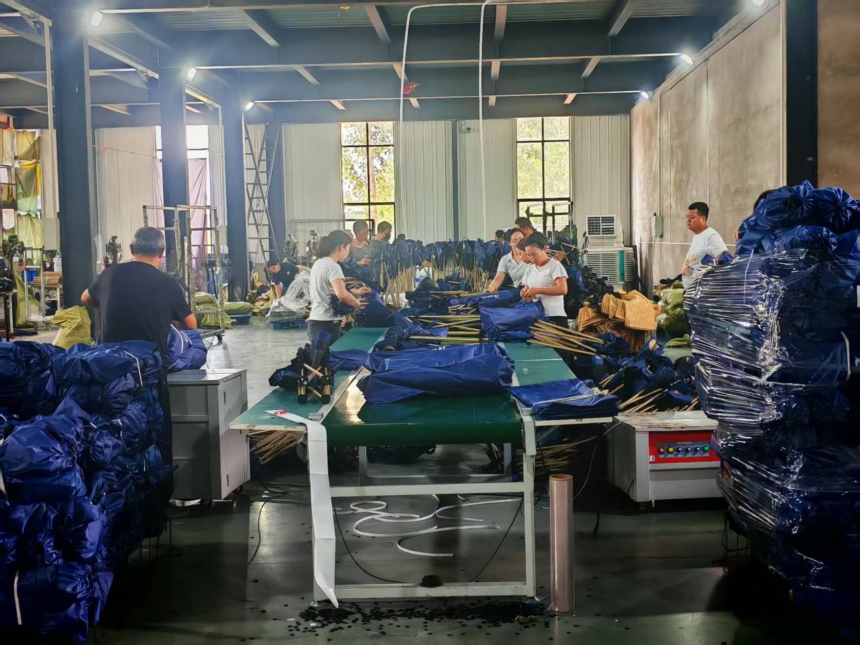 Camping furniture production and assembly workshop with factory workers
